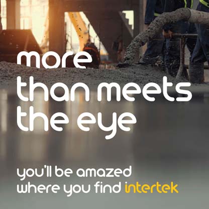 Mud being pumped out of a large pipe at an industrial site