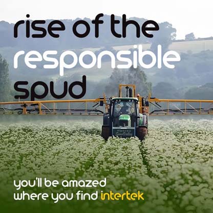 A truck watering a large crop