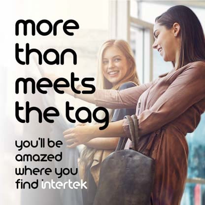 Two women looking at garments at a store